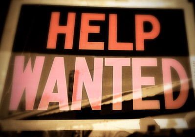 help wanted sign shows choice between employment and education
