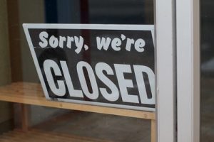 Closed sign illustrates job insecurity
