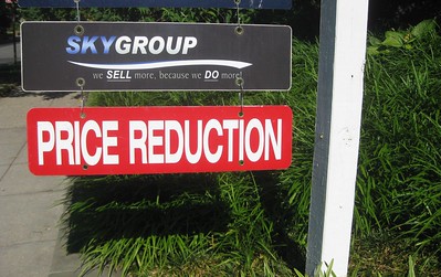 price reduction sign housing correction