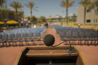 microphone and empty chairs community college