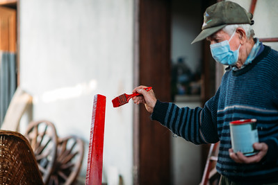 man painting fence retirement savings